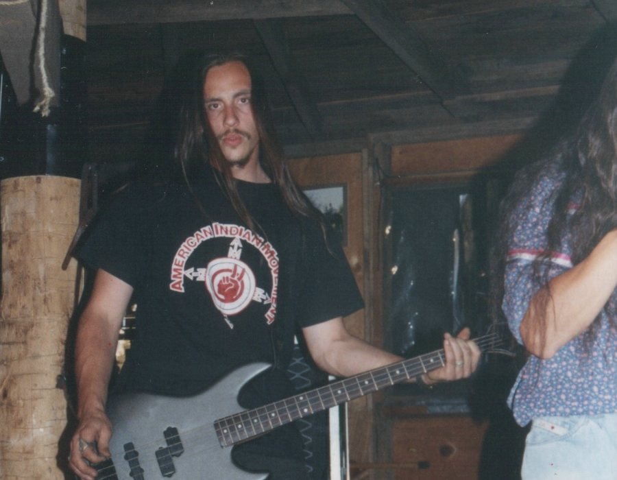 Micah Owens playing bass guitar
